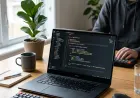 Beginner learning a PHP backend framework with code editor and web app preview.
